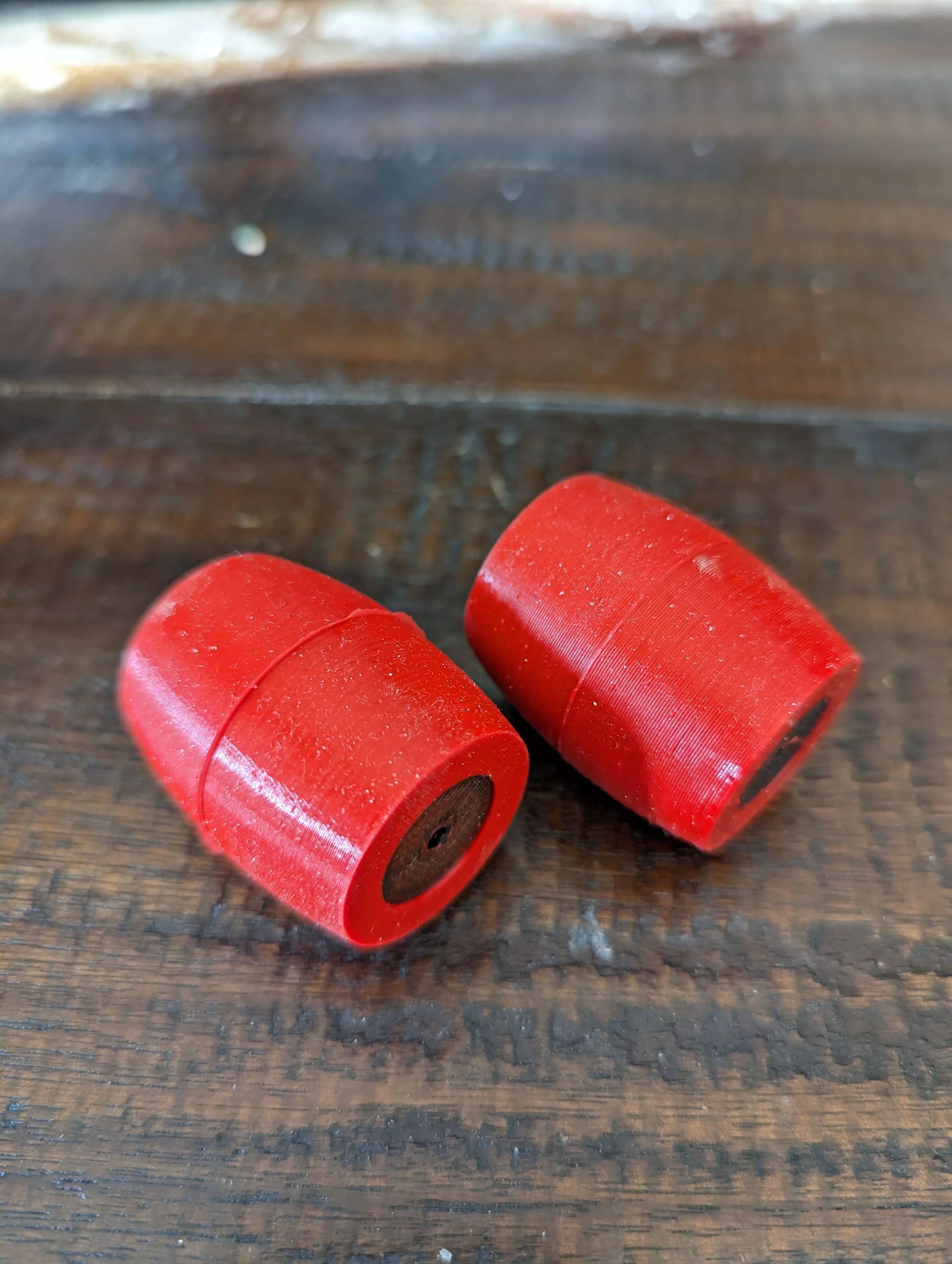 A pair of overmolded rollers placed horizontally