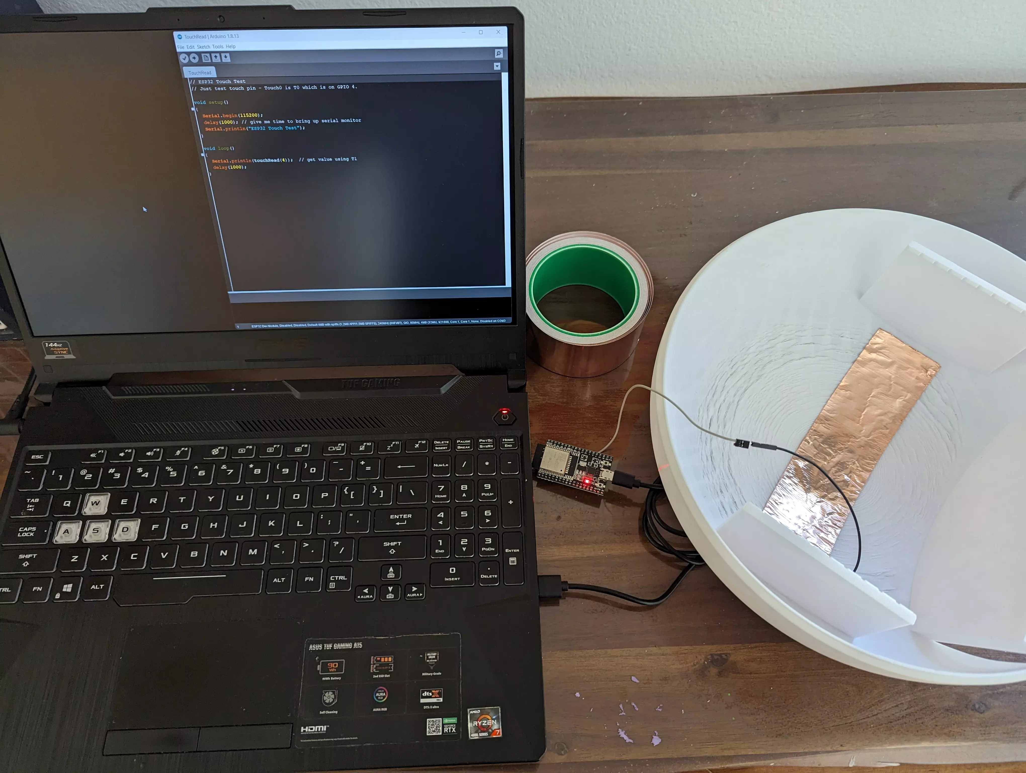 Snoopy''s head with copper tape on the inside connected to an ESP32