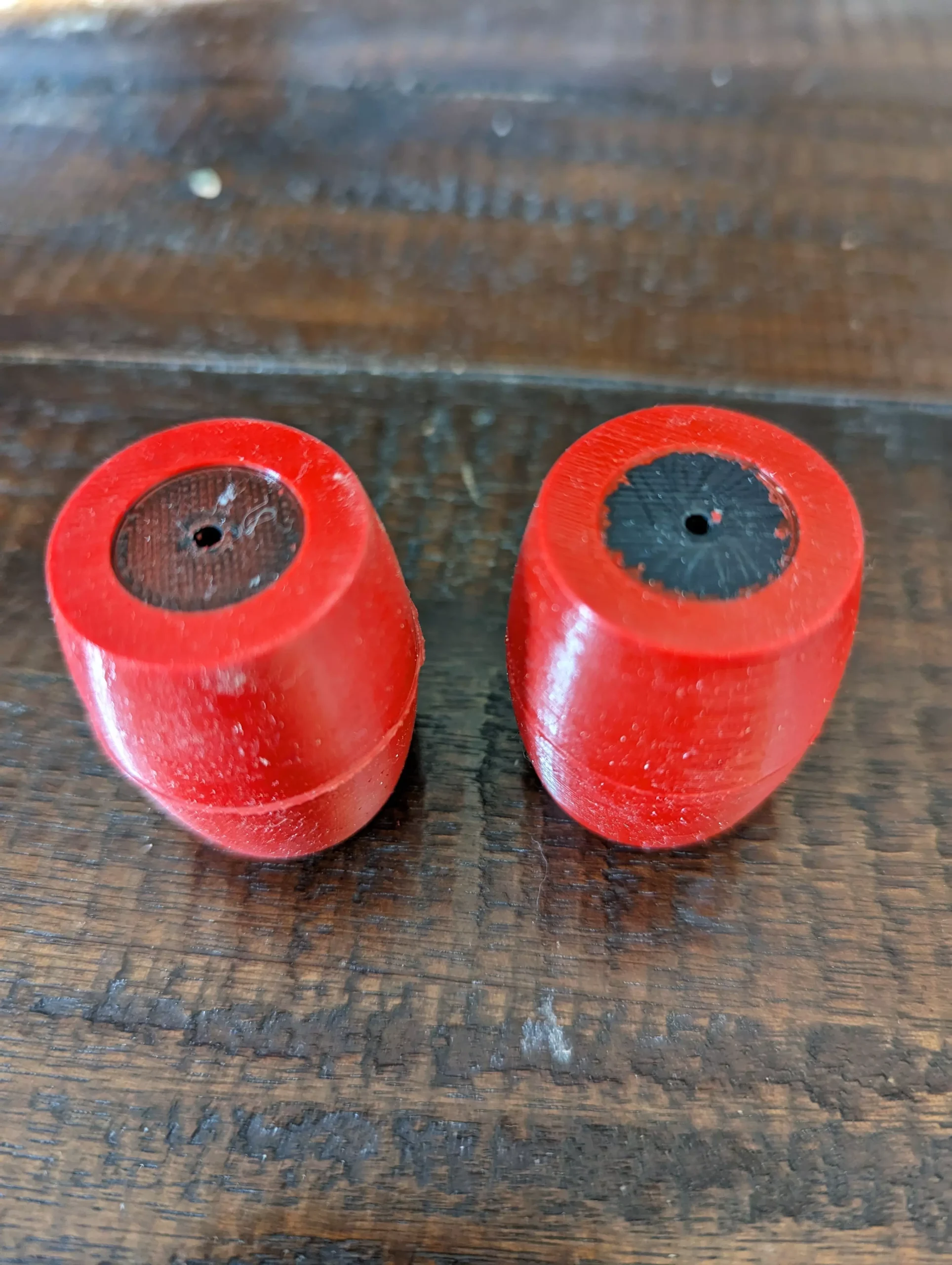 A pair of overmolded rollers standing vertically