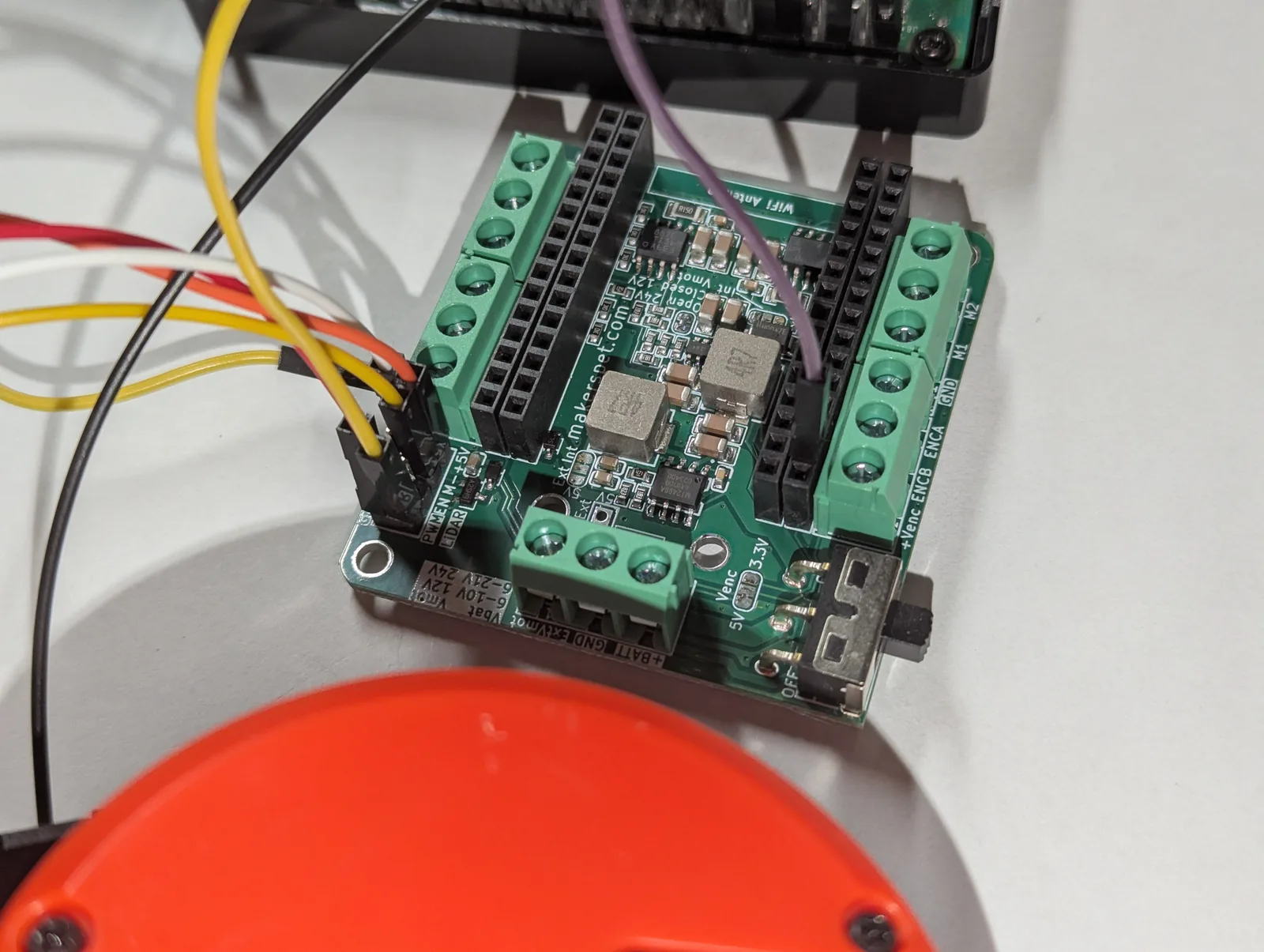 Close-up of the Maker's Pet driver board terminals and LiDAR PWM header