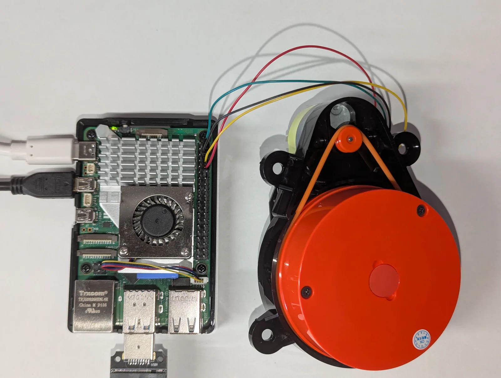 Raspberry Pi 5 connected to a Xiaomi LDS02RR LiDAR with four jumper wires, top view