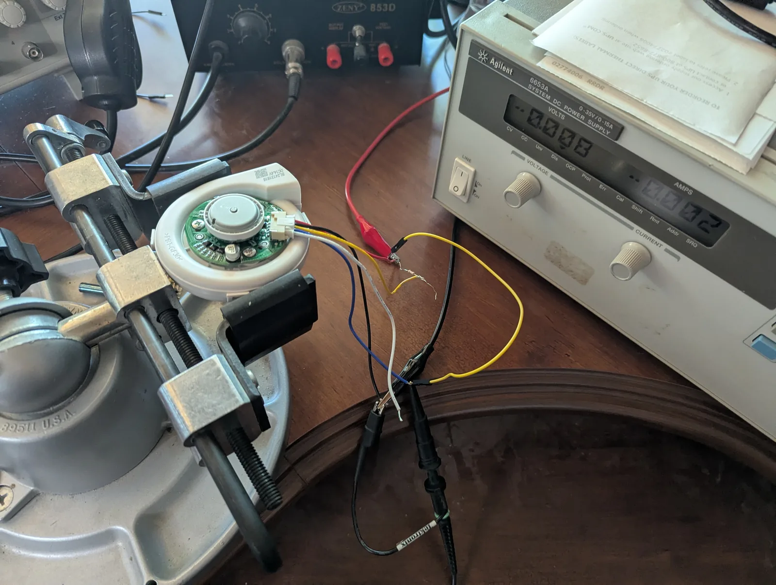 BL24131616 blower clamped in a vise with its 5-pin lead broken out