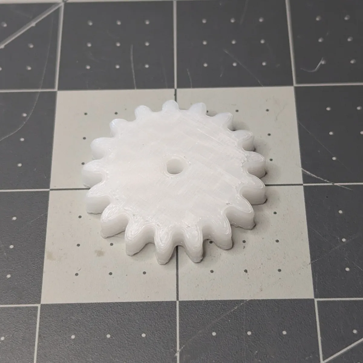Bottom side of the 3D-printed POM gear, with the tooth tips slightly lifted